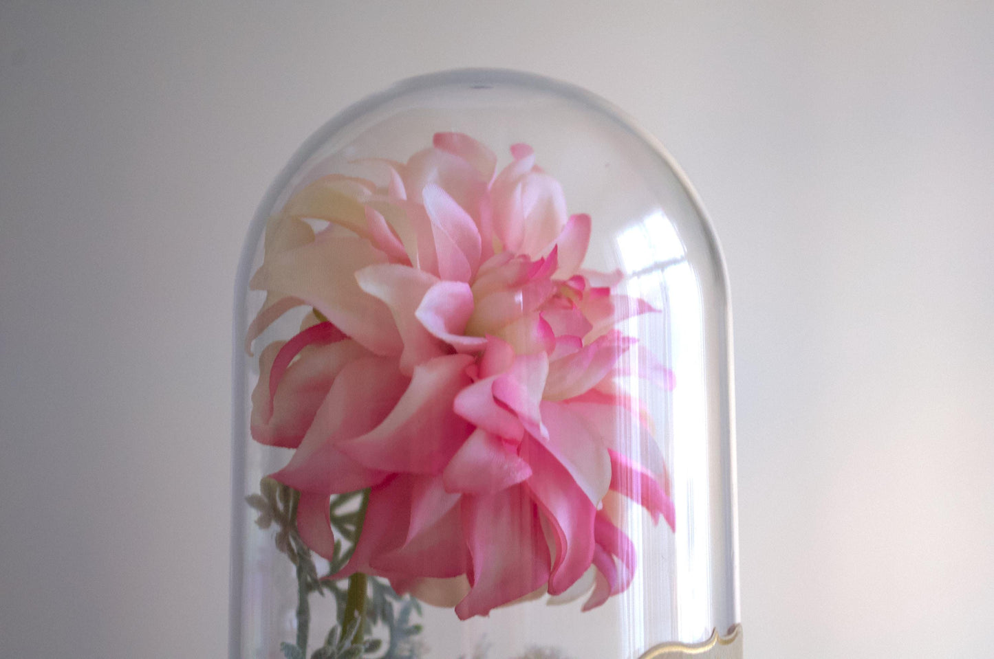 Dahlia silk flower arrangement inside of a flower cloche