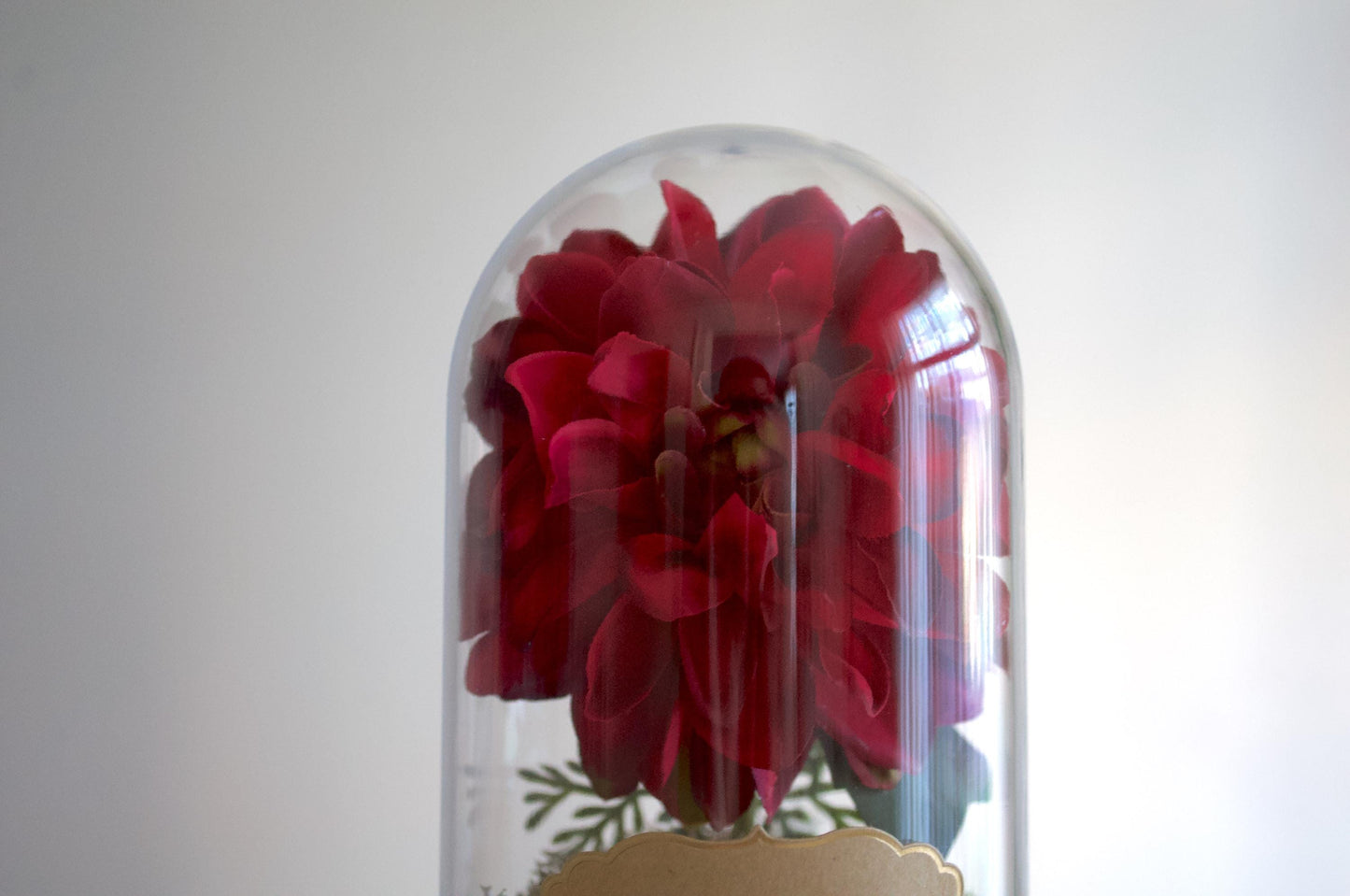 Dahlia silk flower arrangement inside of a flower cloche