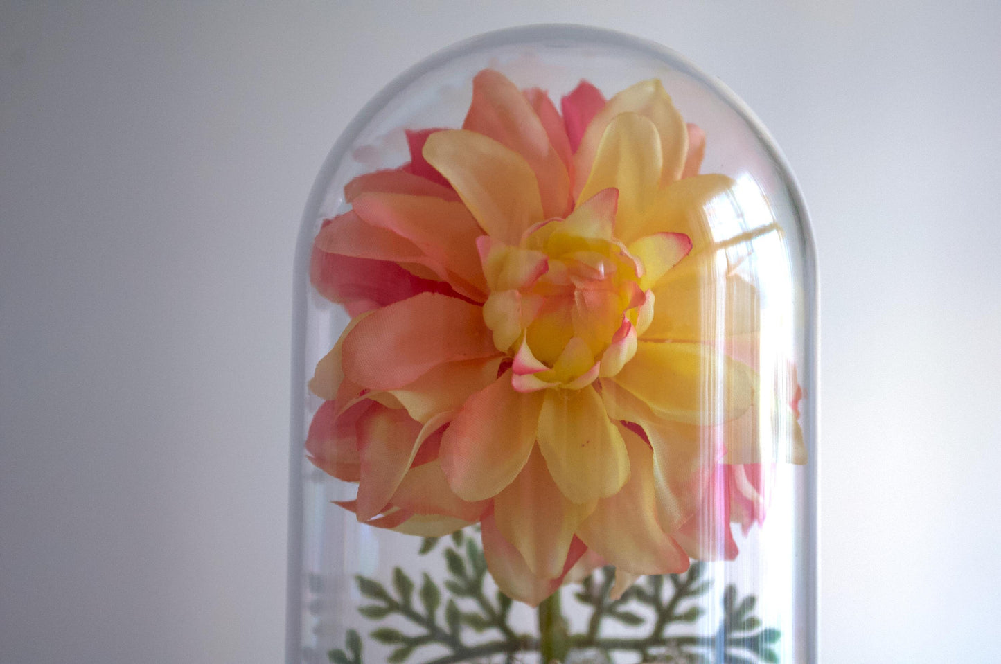 Dahlia silk flower arrangement inside of a flower cloche