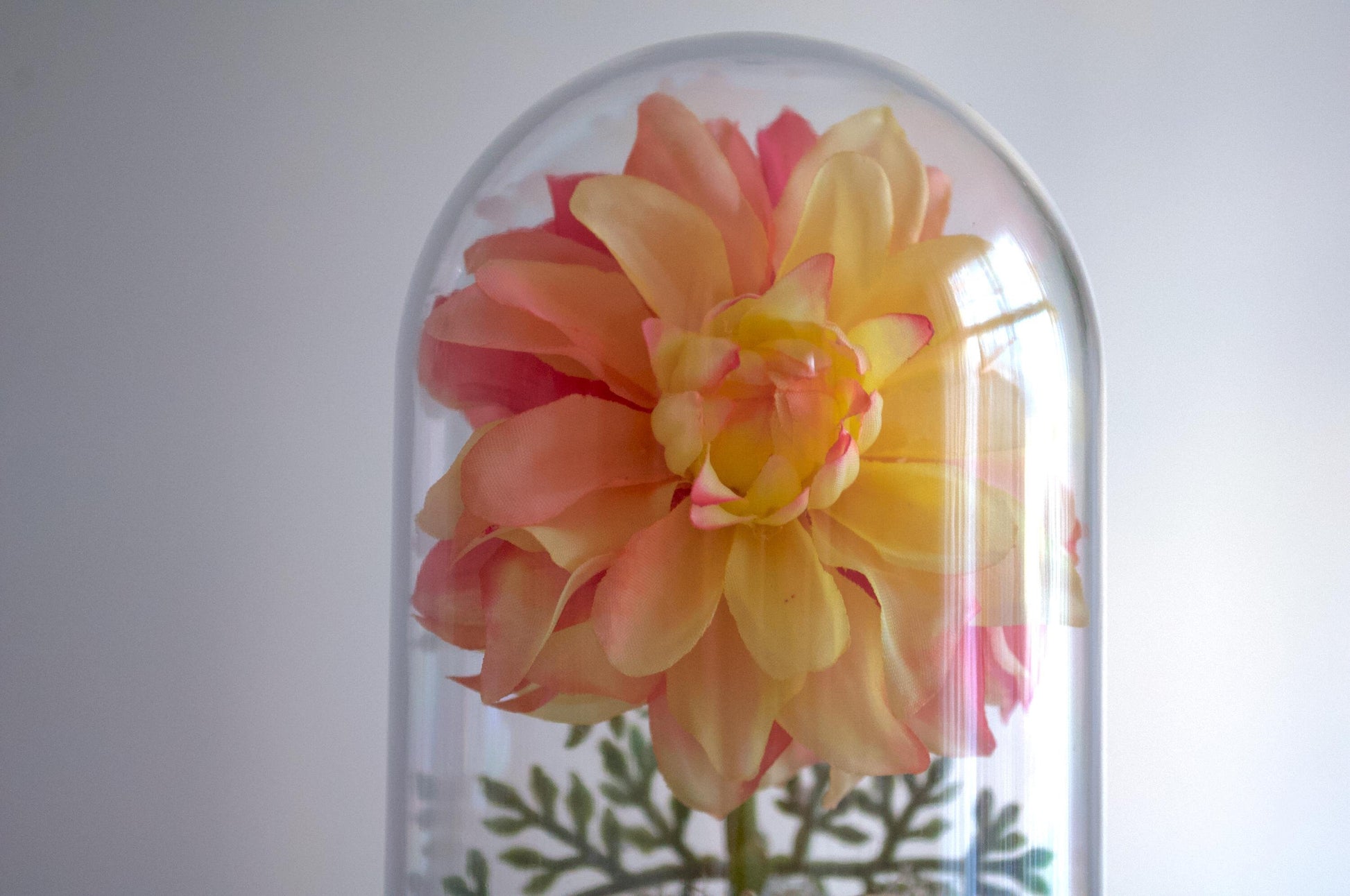Dahlia silk flower arrangement inside of a flower cloche